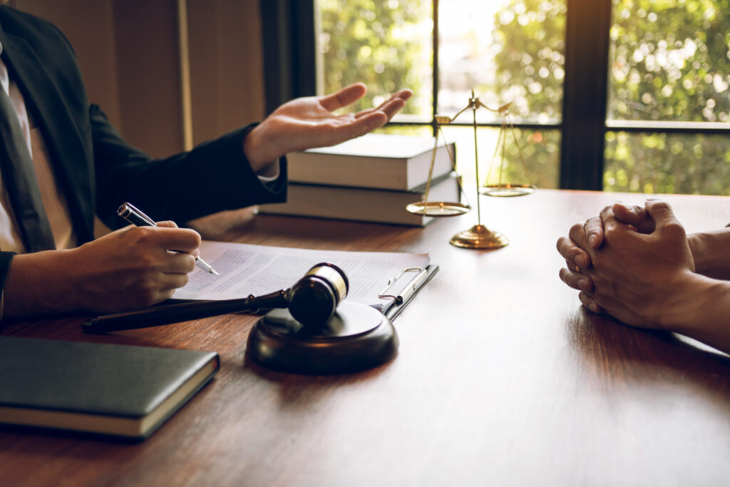 A Mississippi burn injury attorney reviewing official accident records and legal documentation during a client consultation.